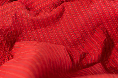 Red striped cloth. Angled view from above.の写真素材