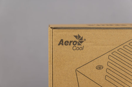 The new VX PLUS 600 aerocool desktop power supply. Brown cardboard box with accessories for a modern...