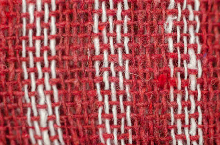 The texture of natural fabric. Perpendicularly woven white and red cotton threads. Kitchen towel or napkin.の写真素材