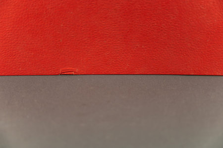 A grayish-red abstract background. Rectangle horizontally divided into two multicolored zones.