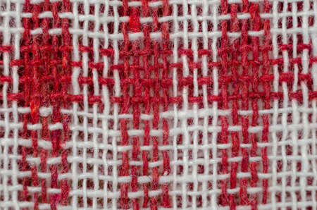 The texture of natural fabric. Perpendicularly woven white and red cotton threads. Kitchen towel or napkin.の写真素材