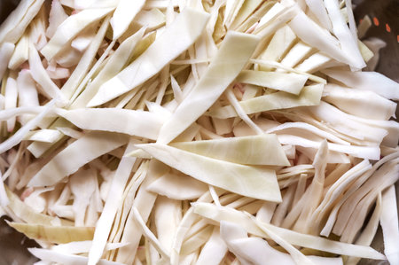 Full frame Sliced white cabbage in strips. The raw vegetable is ready to eat. food, ingredients.