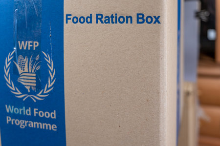Food Ration Box. Cardboard box with humanitarian aid from World Food Program. International aid for the people of Ukraine during the Russian aggression in 2022. Ukraine, Mykolaiv - 06 23 2022のeditorial素材