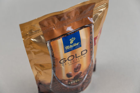 Tchibo Gold Selection coffee against grey. Tchibo German company engaged in the production of coffee, as well as branded clothing, home appliances, household items. Ukraine, Mykolaiv - 06 22 2022のeditorial素材