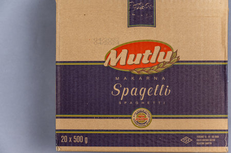 Large cardboard box of spaghetti. Products of the largest Turkish brand Mutlu Makarna. food and grocery products. selective focus. Ukraine, Mykolaiv - 06 23 2022.のeditorial素材
