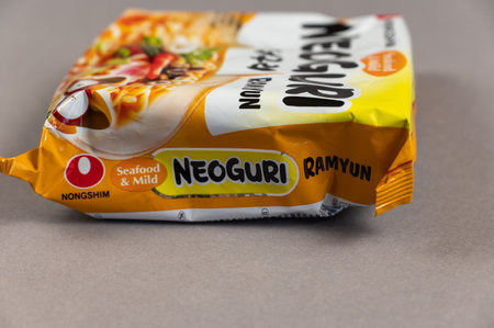 Neoguri Ramyun instant noodles. Colorful plastic packages on grey. Products of Nongshim Co, Ltd. It is the largest South Korean manufacturer of instant food, snacks and drinks. Ukraine, Kiev - 06 22 2022のeditorial素材