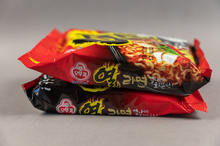 Yeul Ramen instant noodles. Two brightly colored plastic packages on grey. Products of the South Korean company Ottogi Co, Ltd. headquartered in Anyang-si, South Korea. Ukraine, Kiev - 06 22 2022のeditorial素材
