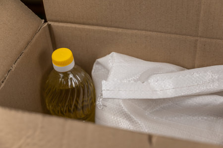Open donation box with various groceries. top view. selective focus. no people.の写真素材