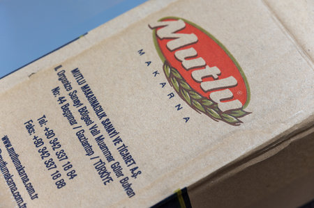 Large cardboard box of spaghetti. Products of the largest Turkish brand Mutlu Makarna. food and grocery products. selective focus. Ukraine, Mykolaiv - 06 23 2022.のeditorial素材