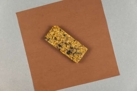 Protein Energy Bar on brown. A gluten-free, sugar-free snack. Oatmeal flapjack with fruit. Healthy Foods.の写真素材