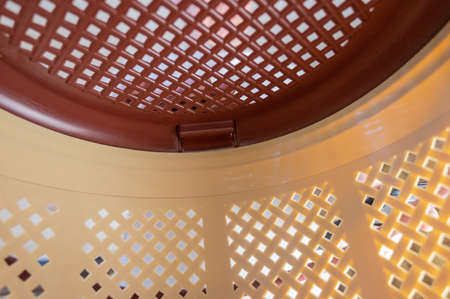 Brown pet carrier basket. Closed plastic cat carrier in close-up. inside view. selective focus.の写真素材
