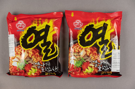 Yeul Ramen instant noodles. Two brightly colored plastic packages on grey. Products of the South Korean company Ottogi Co, Ltd. headquartered in Anyang-si, South Korea. Ukraine, Kiev - 06 22 2022のeditorial素材