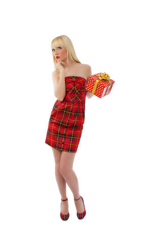 Beautiful young blonde model posing in red dress on white backgroundの写真素材