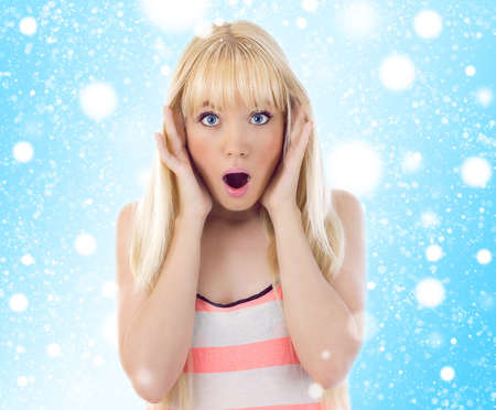 Woman looking surprise. Snowflakesの写真素材