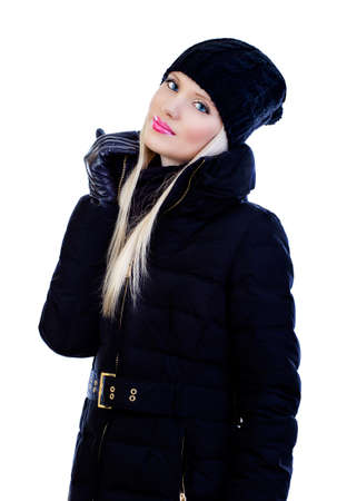 Beautiful blonde young woman in black jacket on white backgroundの写真素材