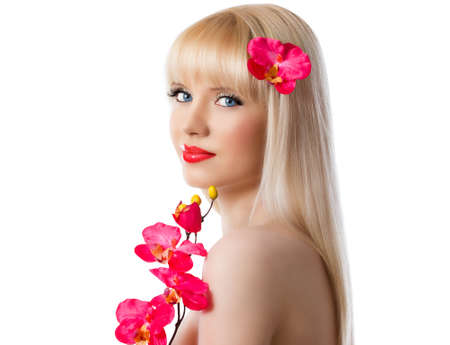 Pretty blonde girl with red orchid flowers on white backgroundの写真素材