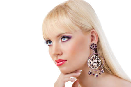 Pretty young blonde girl with purple makeupの写真素材