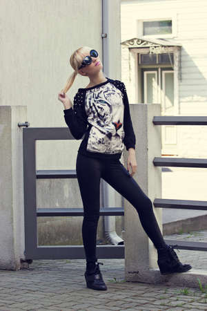 Beautiful blonde girl in pullover with tiger printの写真素材