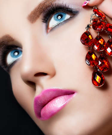 Beautiful girl with make up on black backgroundの写真素材