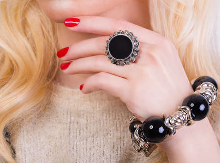 Beautiful blonde model with red manicureの写真素材