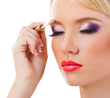 Beautiful blonde girl with purple makeupの写真素材
