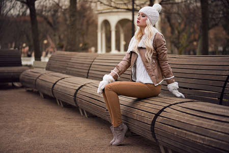 Beautiful blonde girl in posing outdoorsの写真素材