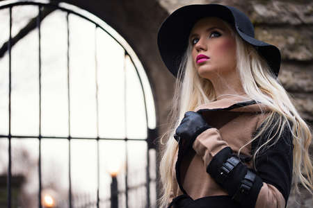 Beautiful blonde girl with makeup outdoorsの写真素材