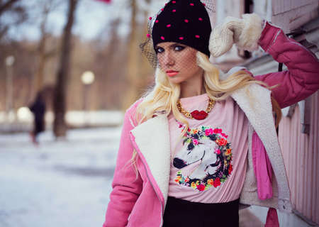 Beautiful blonde girl with makeup outdoorsの写真素材