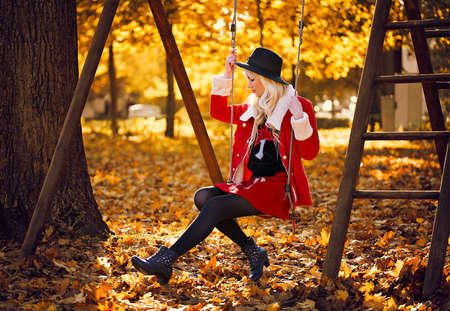 Beautiful blonde girl in posing outdoorsの写真素材