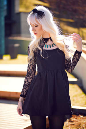 Pretty young woman in posing outdoorsの写真素材