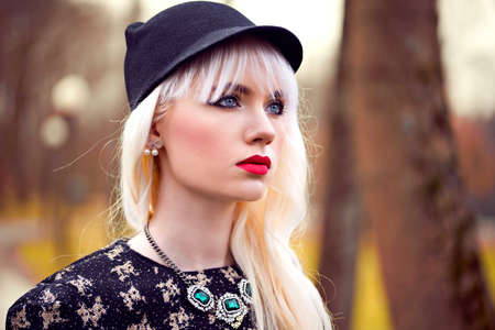 Portrait of beautiful blonde girl with makeup outsideの写真素材