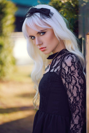 Portrait of beautiful blonde girl with makeup outsideの写真素材