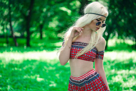 Beautiful girl in sunglasses outdoorsの写真素材