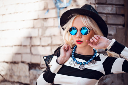 Beautiful girl in sunglasses outdoors