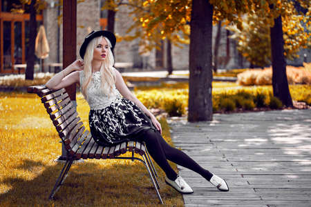 Beautiful blonde woman in posing outdoorsの写真素材