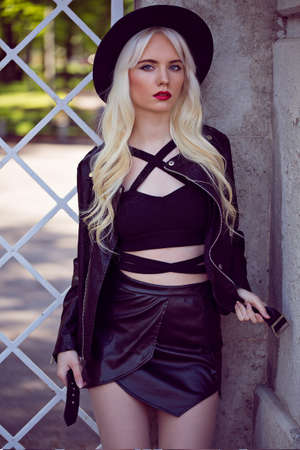 Beautiful blonde model in posing outdoorsの写真素材