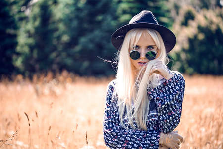 Beautiful blonde model in posing outdoorsの写真素材