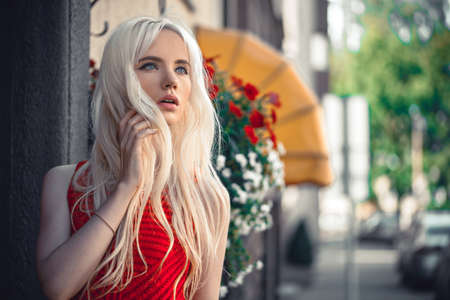 Beautiful blonde model in posing outdoorsの写真素材