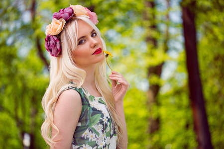 Beautiful blonde model in posing outdoorsの写真素材