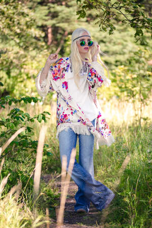 Beautiful blonde model in posing outdoorsの写真素材