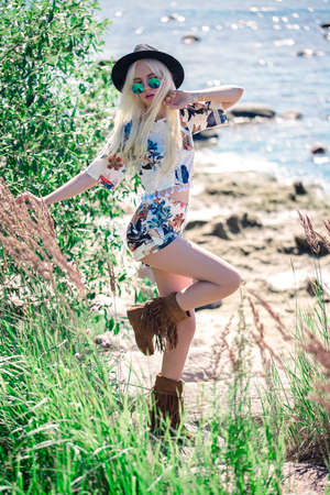 Beautiful blonde model in posing outdoorsの写真素材