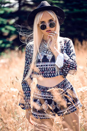 Beautiful blonde model in posing outdoorsの写真素材