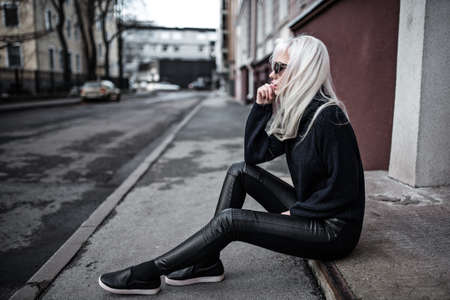 Beautiful blonde model in posing outdoorsの写真素材