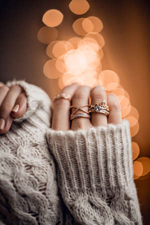 Beautiful girl on golden bokeh lights backgroundの写真素材