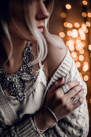 Beautiful girl on golden bokeh lights backgroundの写真素材