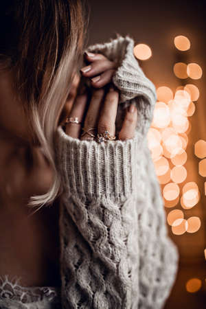 Beautiful girl on golden bokeh lights backgroundの写真素材