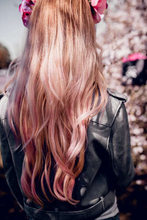 Stylish model with healthy long hair outdoorの写真素材