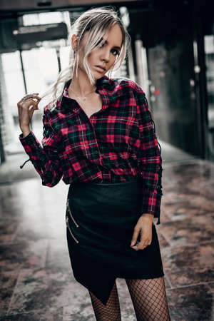 Stylish young woman in posing outdoorsの写真素材