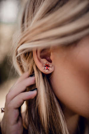 Beautiful red snow earring on close upの写真素材