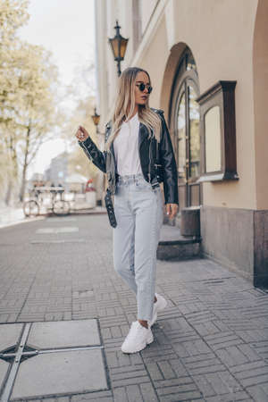 Stylish woman posing in outdoorの写真素材